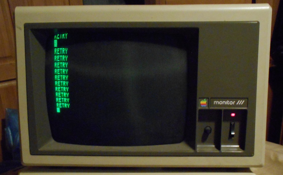 2 Monitor IIIs, Monitor III stand for Apple II series, 2 Disk II Drives with Controller, and an